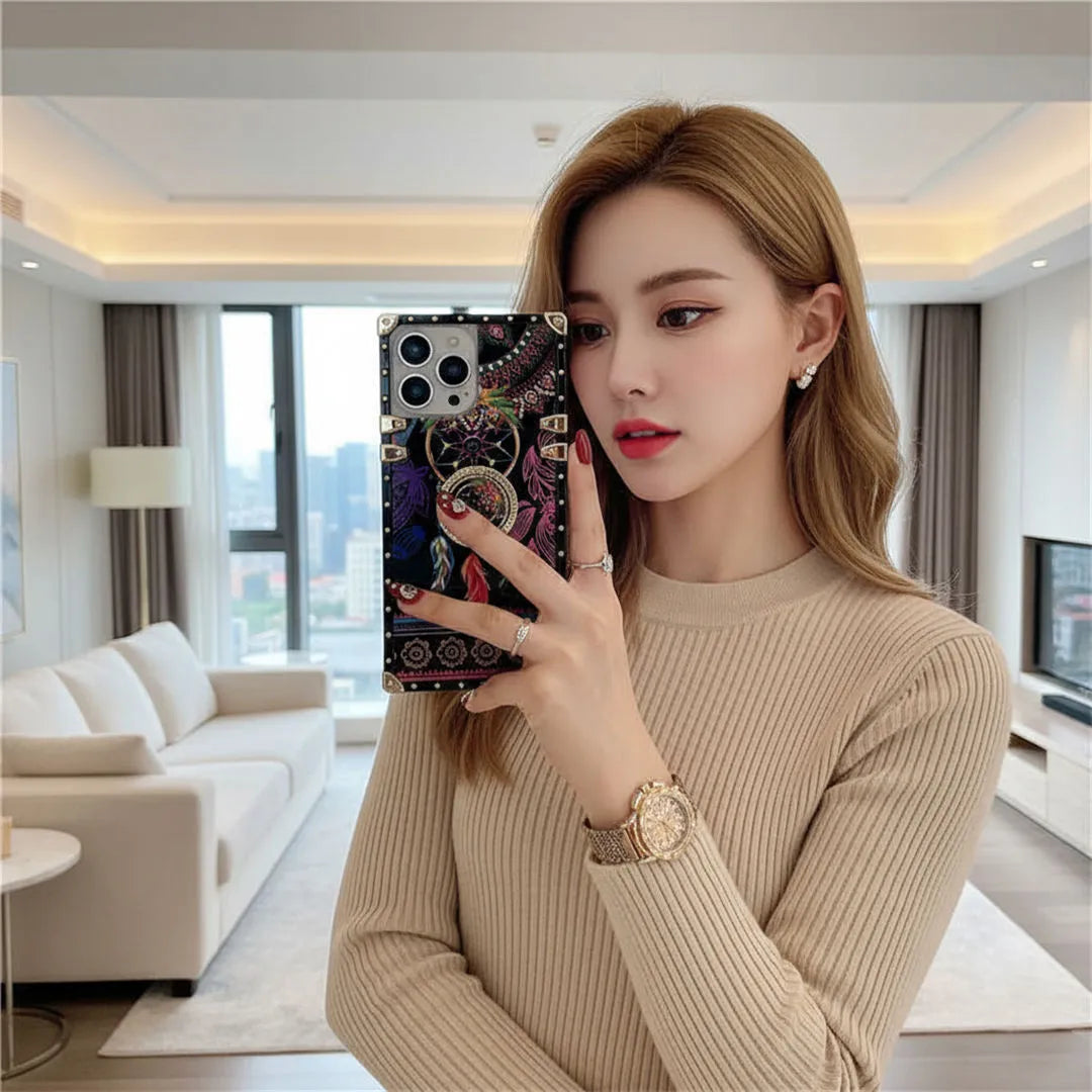 Woman taking a mirror selfie in a modern living room