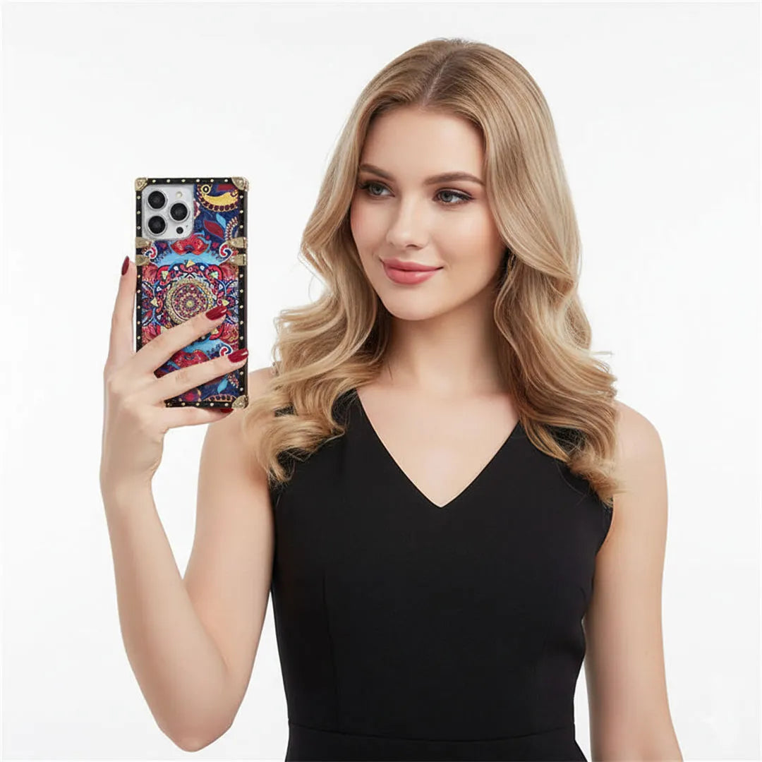 Woman holding a phone with a colorful case against a white background