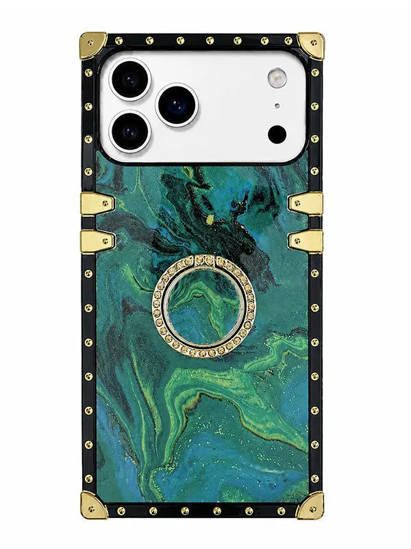 A protective phone case featuring a green and teal marbled pattern, framed by a black border with gold-tone rivets and corner protectors, and a central circular ring stand embellished with small clear stones.