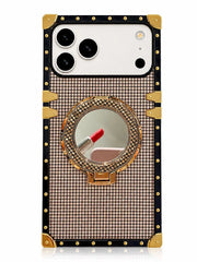 A luxury-style smartphone case with a black border, gold corner protectors and hinges, and a central round mirror set in a rhinestone-embellished gold and pink grid pattern. The case is shown on a white phone against a clean white background.