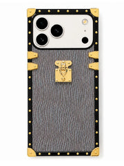 A luxury-style phone case designed for a triple-camera smartphone, featuring a textured gray and black wavy pattern with gold-tone metal studs, corner protectors, and a central clasp lock.