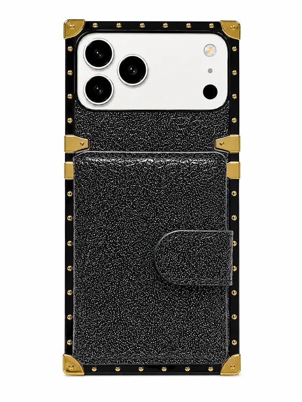A black textured leather phone case with gold-tone metal corner protectors and rivet details, shown on a white smartphone against a plain white background.