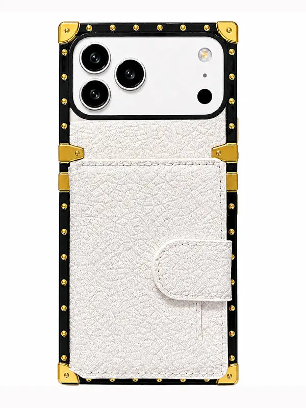 A white textured faux-leather phone case with a snap-button flap pocket, featuring a black border with gold-tone metal studs and corner protectors, shown on a white background.
