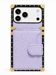 A light purple textured faux leather phone case with a snap-button flap pocket and gold-tone metal corner protectors and studs, shown on a white background.