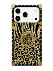 A protective phone case featuring a black and gold leopard print lower section, a black and gold zebra stripe pattern upper section, and a circular rhinestone-embellished gold center ring, all framed by a black border with gold studs and corner protectors.