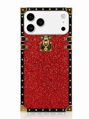 A red glittery phone case designed for a Samsung Galaxy Ultra, styled like a vintage trunk with gold-tone metal corner protectors, studs, and a central padlock clasp, shown on a white background.
