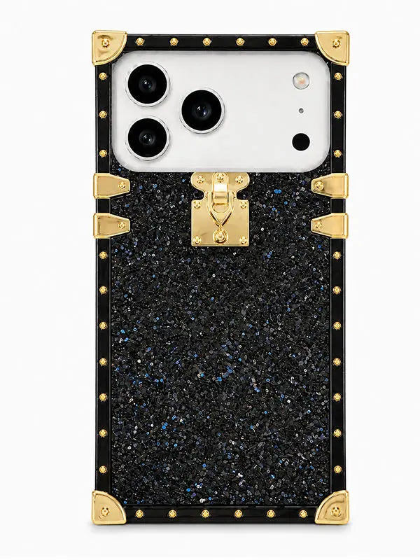 A luxury-style smartphone case featuring a black glittery textured body with gold-tone metal trim, corner protectors, and a central clasp, shown on a white phone against a light gray background.