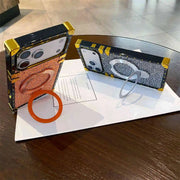 Two stylish phone cases with a ring holder on a wooden surface