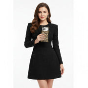 Woman wearing a black dress holding a phone with a geometric case on a white background