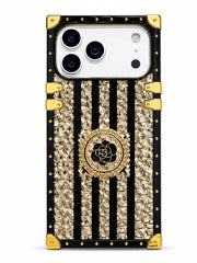 A luxury phone case designed for a Google Pixel, featuring a black and gold color scheme. The case has vertical black stripes with textured gold crystal-like inserts, a central gold circular medallion with a black rose motif, and gold-tone metal corner protectors and rivets.