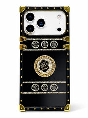A luxury-style black phone case with gold-tone rivets, corner protectors, and rose motifs, shown on a white background.