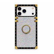 A protective phone case designed for a iPhone 18 Pro Max, featuring a black border with gold-tone rivets and corner protectors, a silver rhinestone-embellished center, and a gold-tone ring stand on the back.
