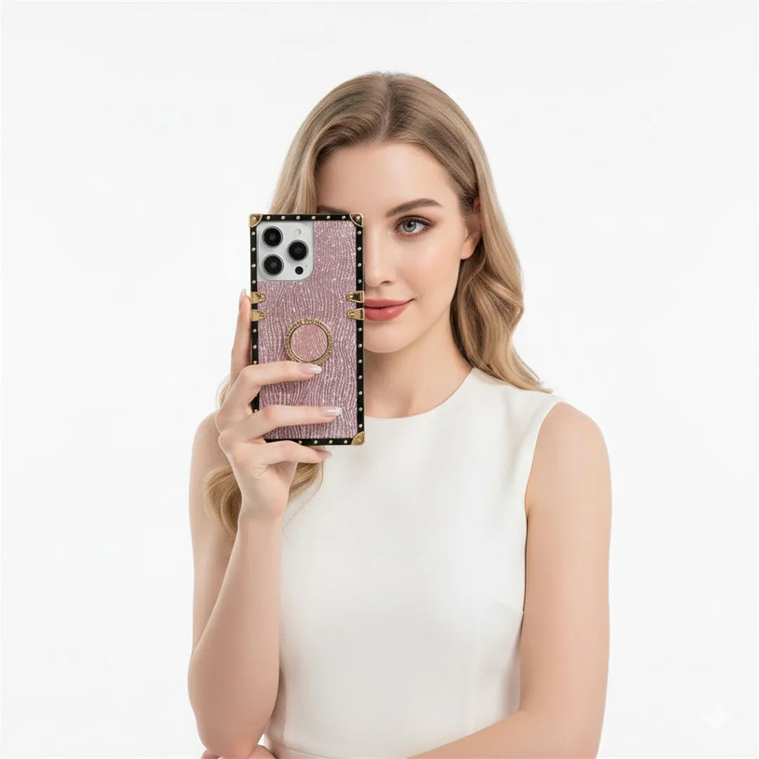 Woman holding a phone with a decorative case against a white background