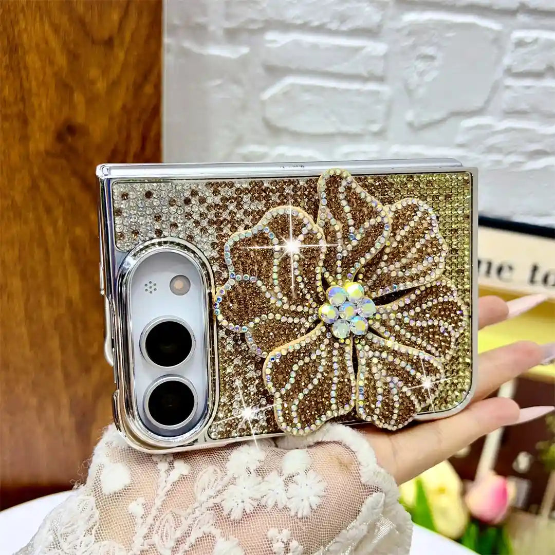 Gold Crystal Bloom Duo case held horizontally, showing its raised rhinestone flower