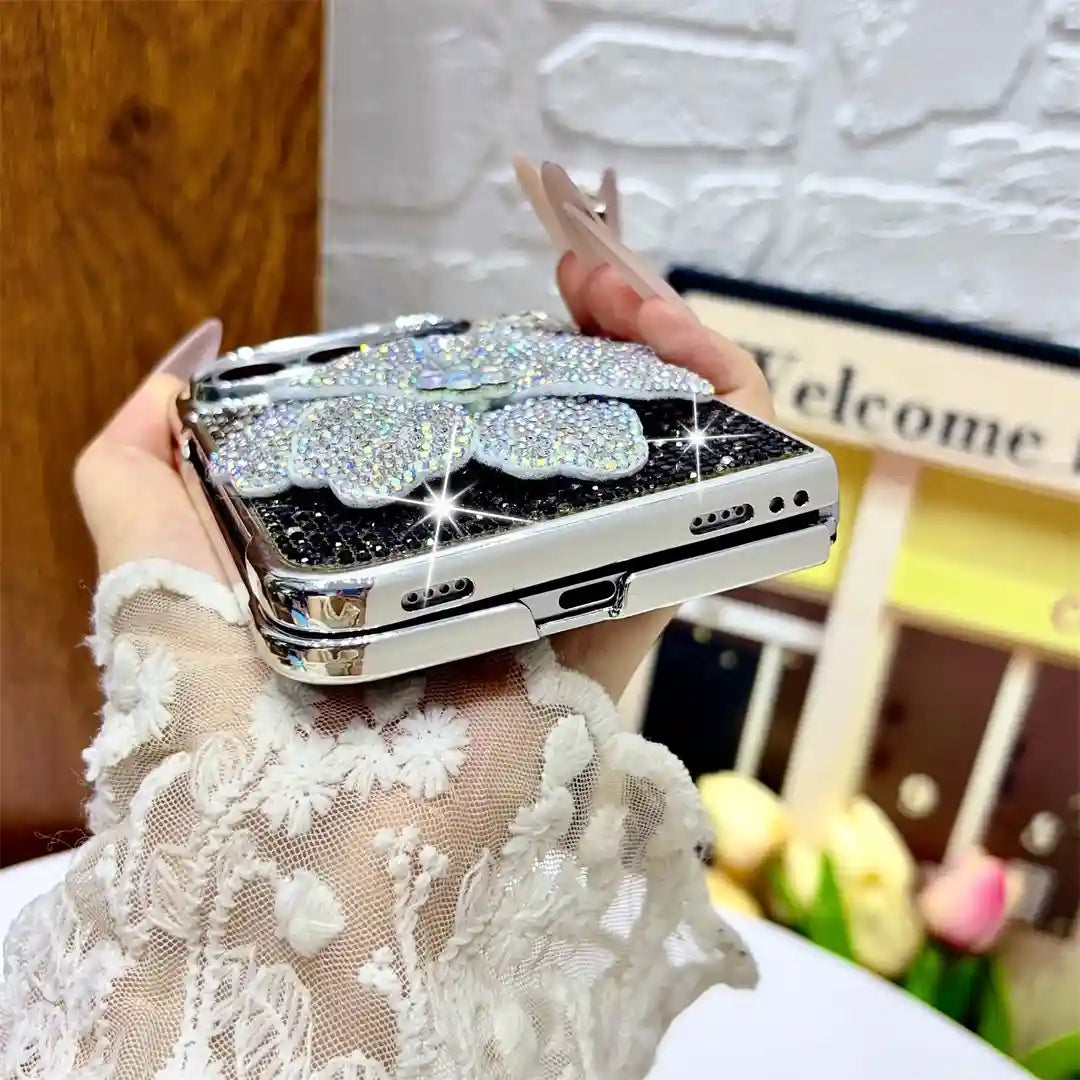 Bottom view of the silver Crystal Bloom Duo case showing charging-port and speaker cutouts