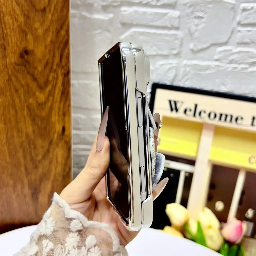 Side view of a folded iPhone Duo in the Crystal Bloom Duo case showing clear edges and button openings