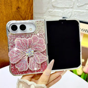 Open iPhone Duo in the pink Crystal Bloom Duo case with a raised rhinestone flower