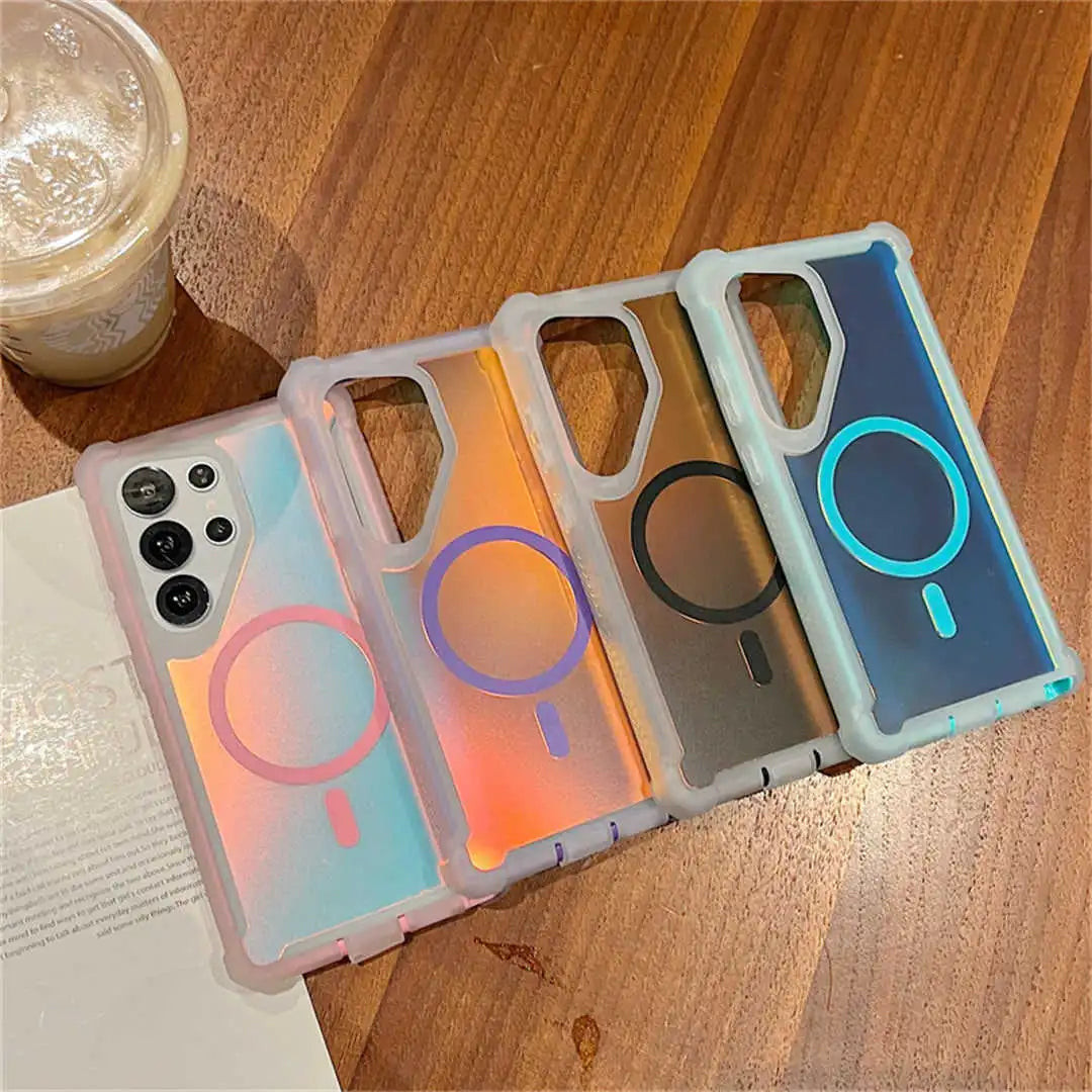 Four Galaxy phone cases with different designs on a wooden surface.