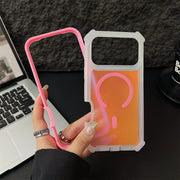 Hand holding a pink and clear phone case with a light bulb design against a blurred office background.