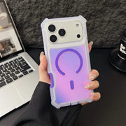 Person holding a phone case with a gradient design in front of a laptop and mug.
