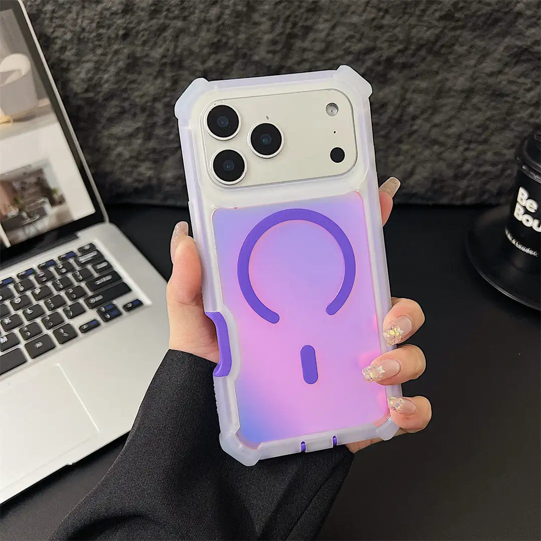 Person holding a phone case with a gradient design in front of a laptop and mug.