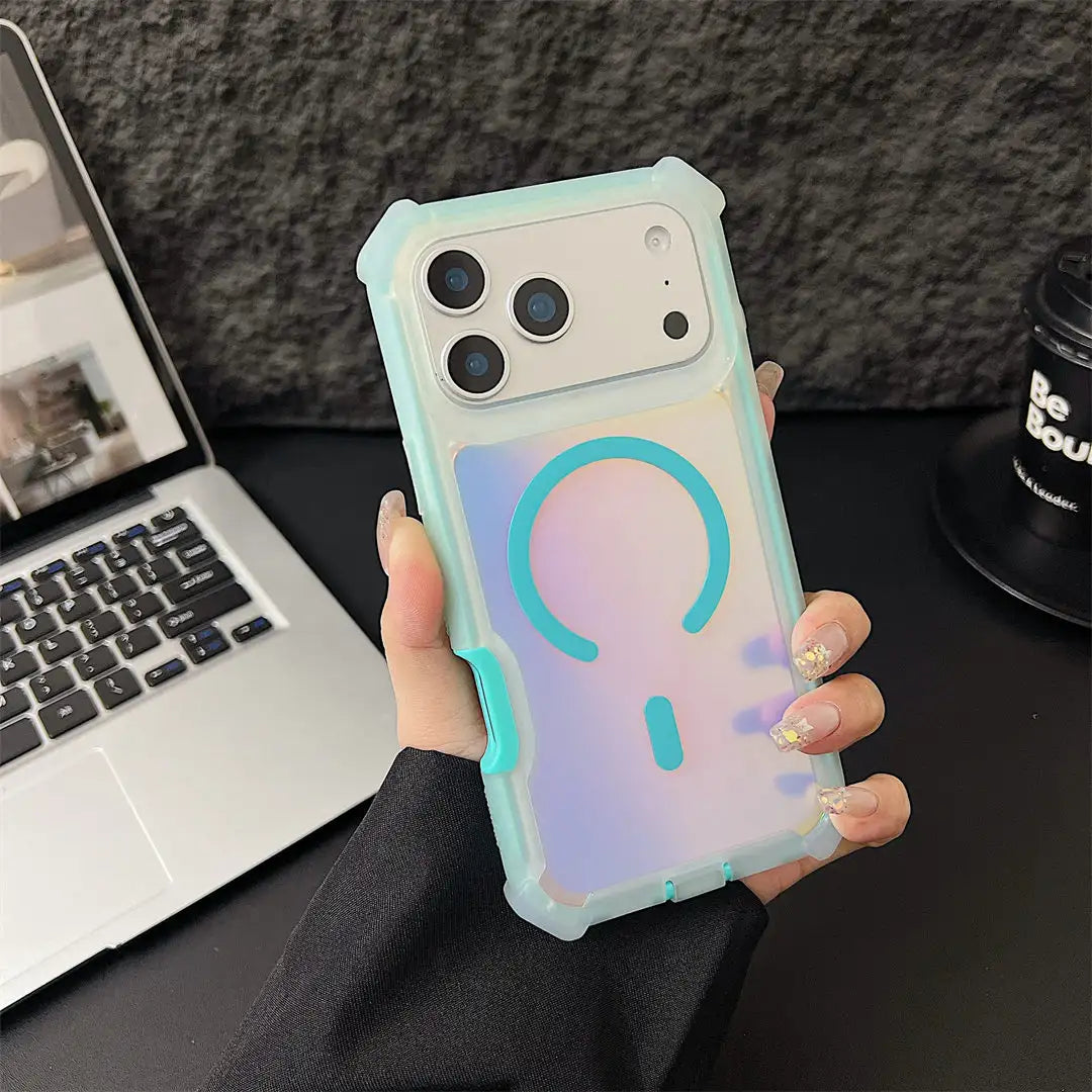 A hand holding a translucent pastel phone case with a large question mark graphic on the back, shown over a desk with a laptop and a black cup in the background.