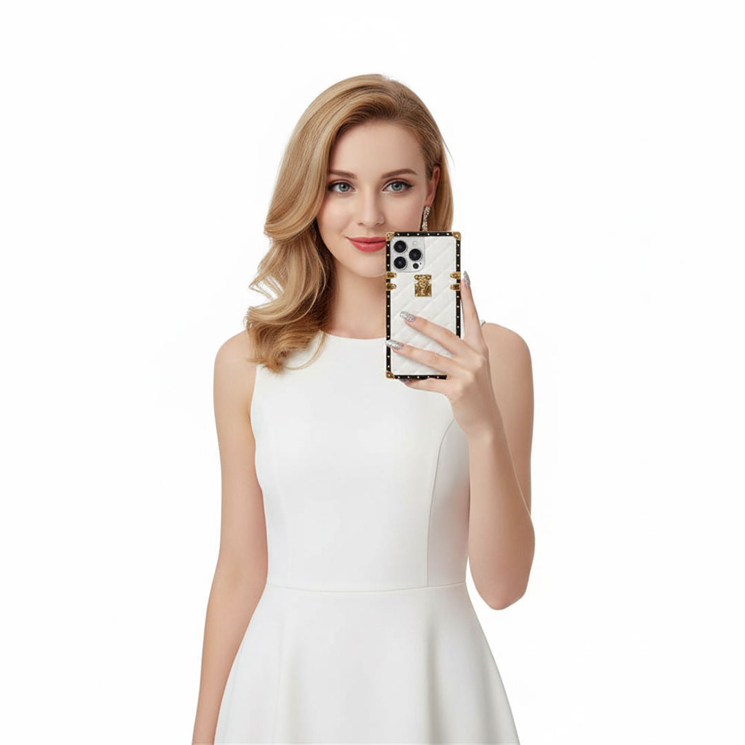 Woman in a white dress holding a smartphone with a decorative case on a white background