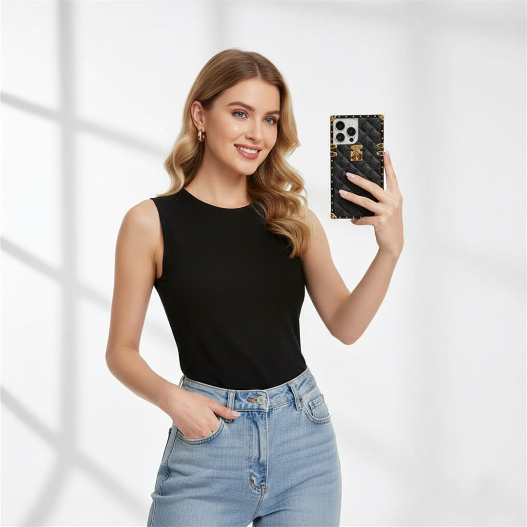 Woman holding a phone with a black square phone case against a white background