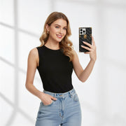Woman holding a phone with a black case against a white background