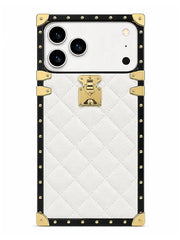 A luxury-style phone case featuring a white quilted leather-texture back, a black border, and gold-tone metal studs, corner protectors, and a central padlock clasp, shown on a white background.