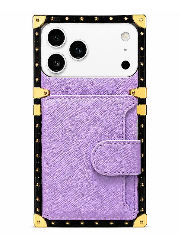 A purple faux-saffiano leather phone case with a snap-button flap pocket, featuring a black studded border with gold-tone metal corner protectors, shown on a white smartphone against a white background.