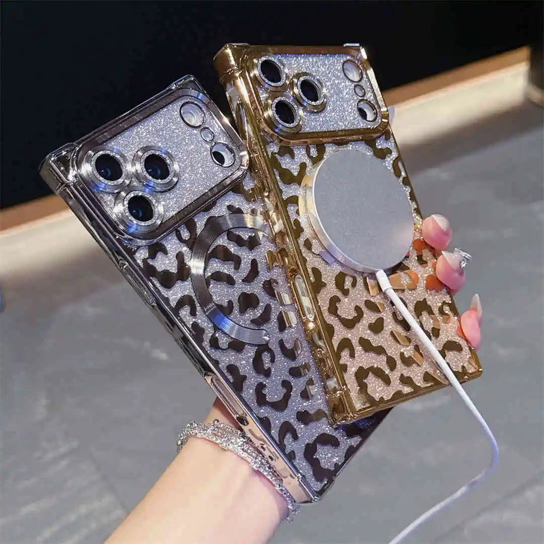 Two decorative phone cases with leopard print and glittery design on a reflective surface.