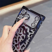 Phone case with leopard print and glittery design held by a hand
