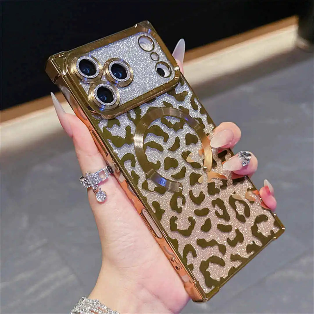 Hand holding a square-shaped phone case with a leopard print design and gold glittery accents.