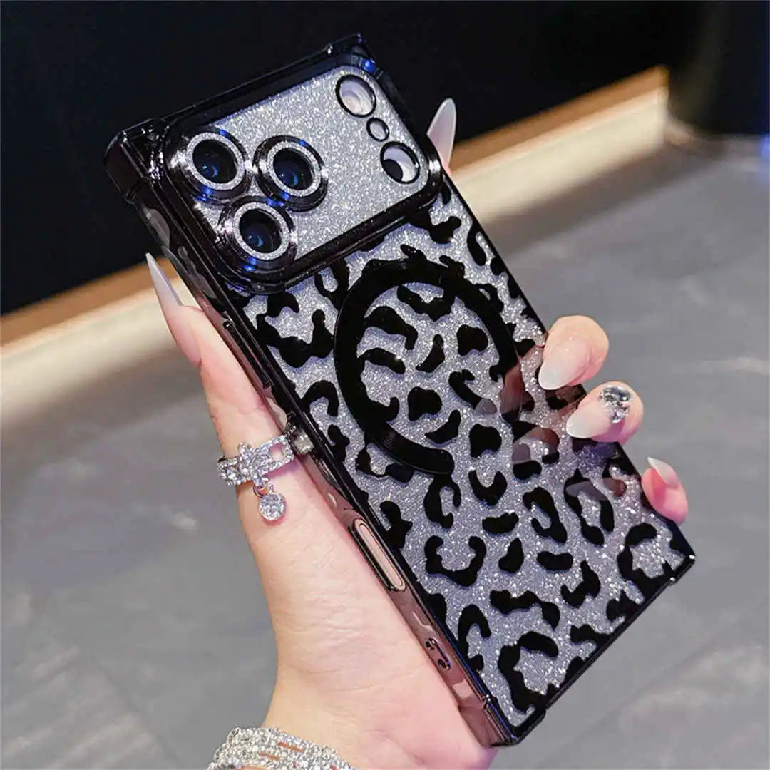 Square phone case with leopard print and black glittery accents held by a hand.