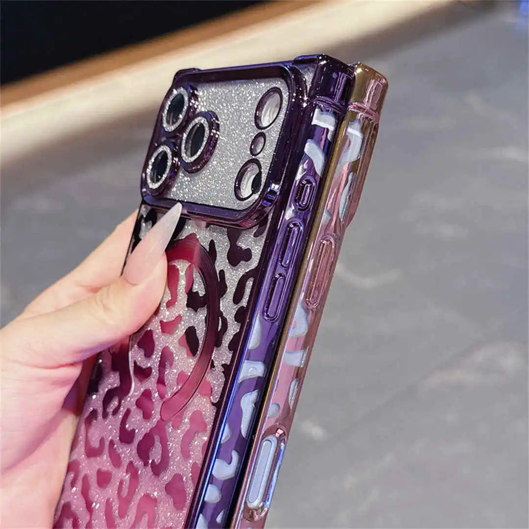Phone case with purple and pink leopard print design held by a hand.