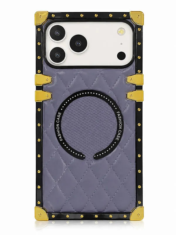 A protective phone case with a quilted lavender-purple back, black trim, gold-tone corner protectors and studs, and a circular magnetic ring on the back.