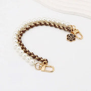Bracelet with pearl and leather sections and gold clasp on a white background