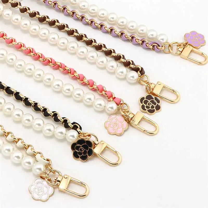 Set of pearl and chain strap options with floral ends on a white background