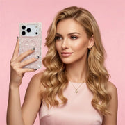Woman holding an opal shell magnetic phone case against a pink background
