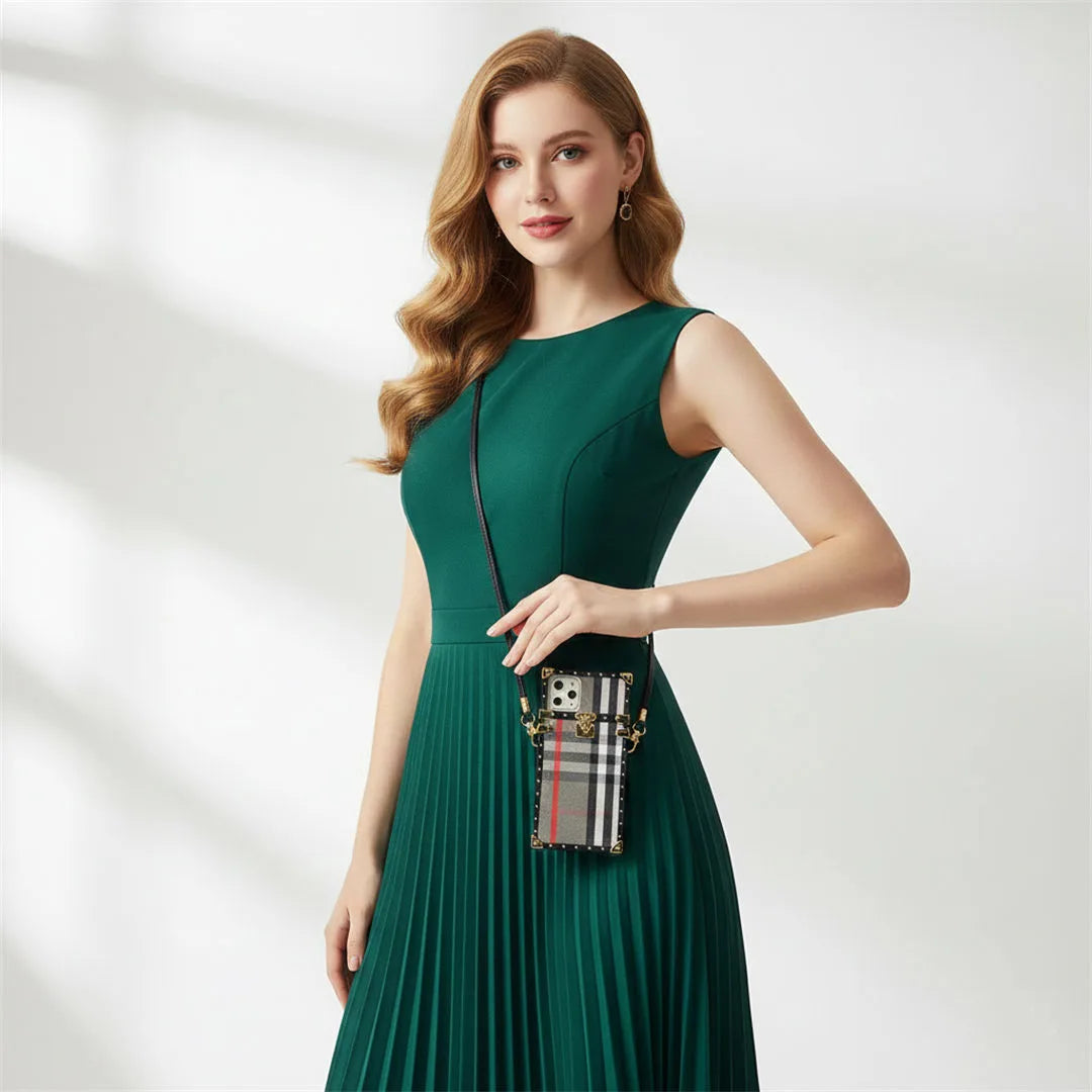 Woman in a green dress holding a handbag with a blurred background