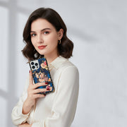 Woman holding a phone with a floral case against a light gray background