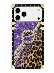 A protective phone case featuring a split design of purple glitter and leopard print, embellished with a faux pearl bracelet graphic, a rhinestone-embellished circular emblem, and a black border with gold studs and corner protectors.
