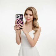 Woman holding a phone with a decorative case against a white background