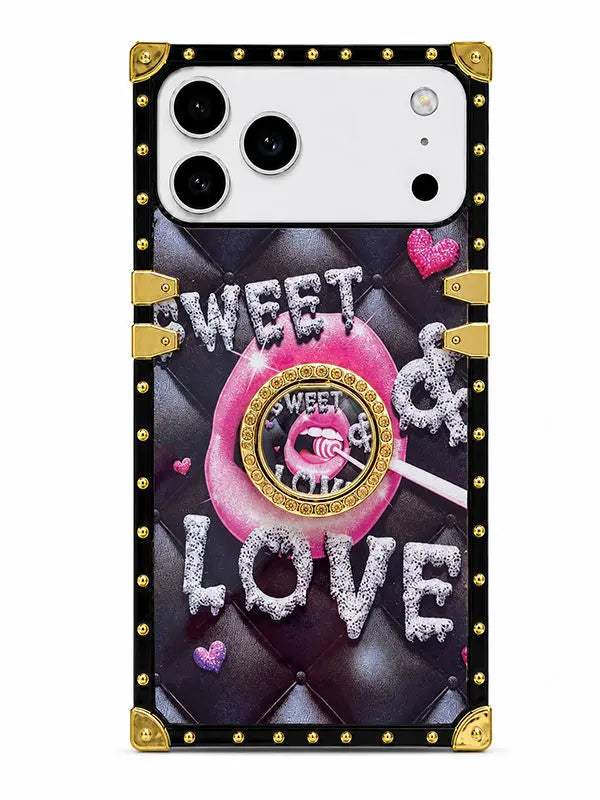 A protective phone case with a black leather-look design, gold-tone rivets and corner protectors, featuring a pink lollipop graphic and the text 'SWEET & LOVE' in glittery silver letters.