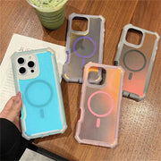 Four phone cases with different color schemes on a wooden surface.