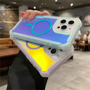 Person holding a phone with a colorful case in an indoor setting