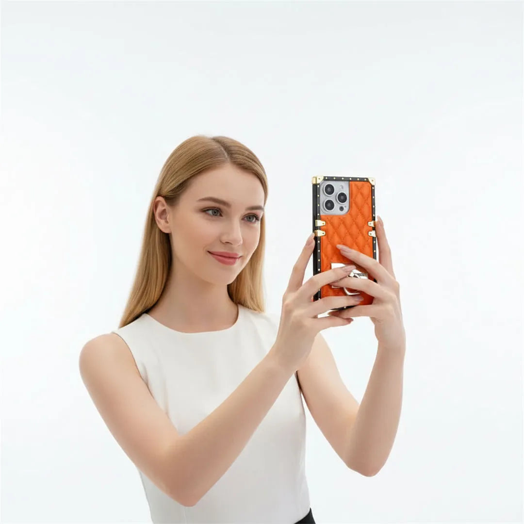 Woman holding a smartphone with a distinctive design on a white background