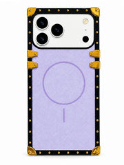 A protective phone case with a light purple backplate and a black border decorated with gold studs, corner protectors, and strap-like accents, shown on a white phone against a white background.