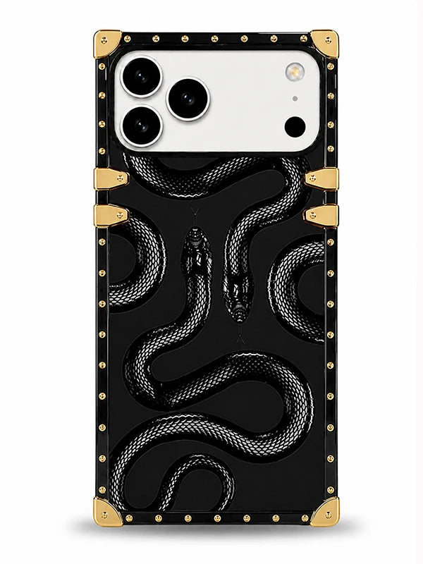 A protective phone case featuring a glossy black background with a raised 3D snake pattern, gold-tone rivets along the border, and gold corner protectors, shown on a white phone against a light gray background.